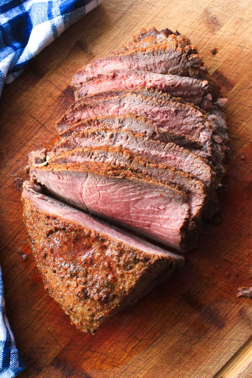 This herb-rubbed Sirloin Tip Roast is a frugal cut of beef that yields deliciously tender, flavorful, juicy meat. You won't believe how easy it is to make! #sirloin #dinner #beefrecipe