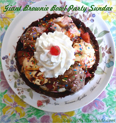 Giant Brownie Bowl Party Sundae is a sweet sharable treat for any group. Make the brownie bowl ahead, then fill, serve, and watch the fun. | Recipe developed by www.BakingInATornado.com | #recipe #dessert