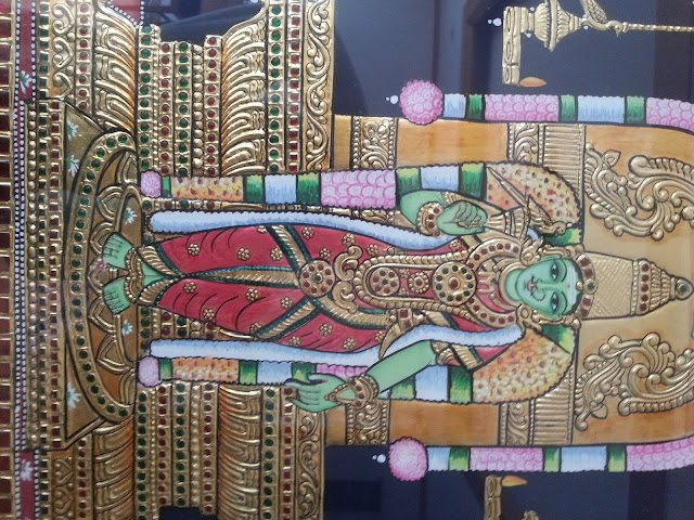 Broad eyes and gold foil along with semi precious stones stones form the unique feature of thanjavur painting