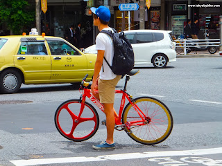 Fixed gear bicycle commuter in Tokyo, Japan