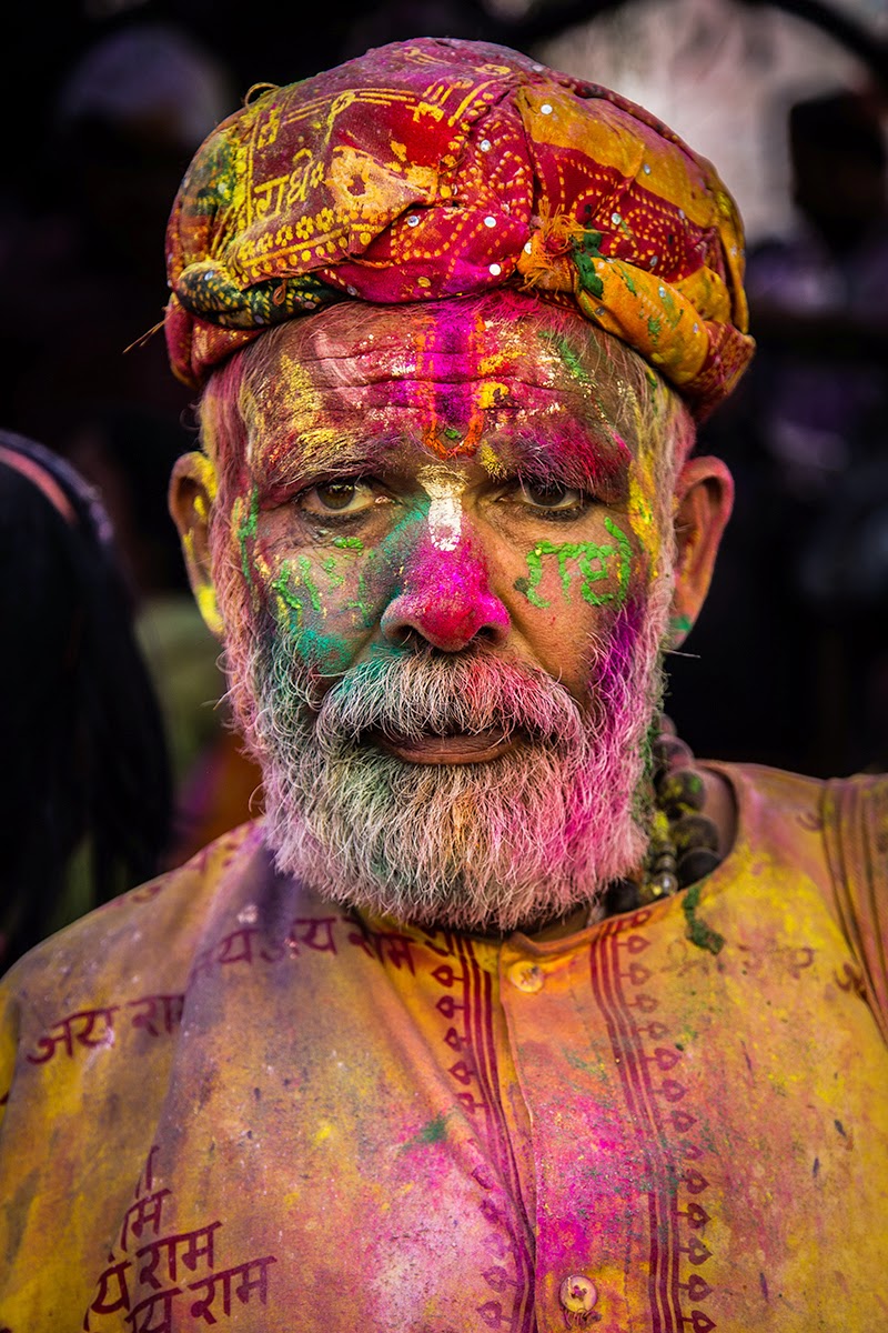 Portrait old Indian man colors colorful faces Lathmar Holi Barsana Nandgaon near Mathura 2015