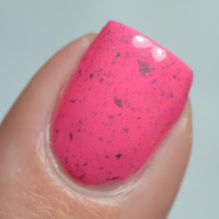 pink nail polish with flakies