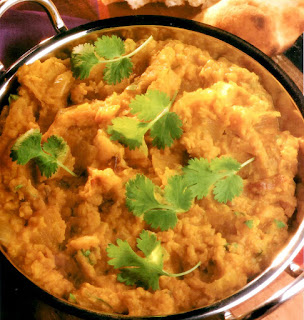 Red lentils with onions, vegetarian curry also known as daal or dhal