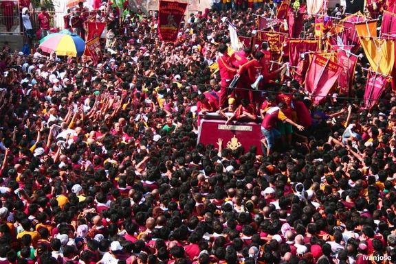 Devotees trying to touch the image of the Black Nazarene during the Holy Week procession