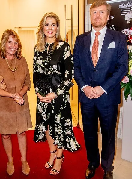 Queen Maxima wore a floral print silk dress by Johanna Ortiz, and she wore Gianvito Rossi sandals, diamond earrings