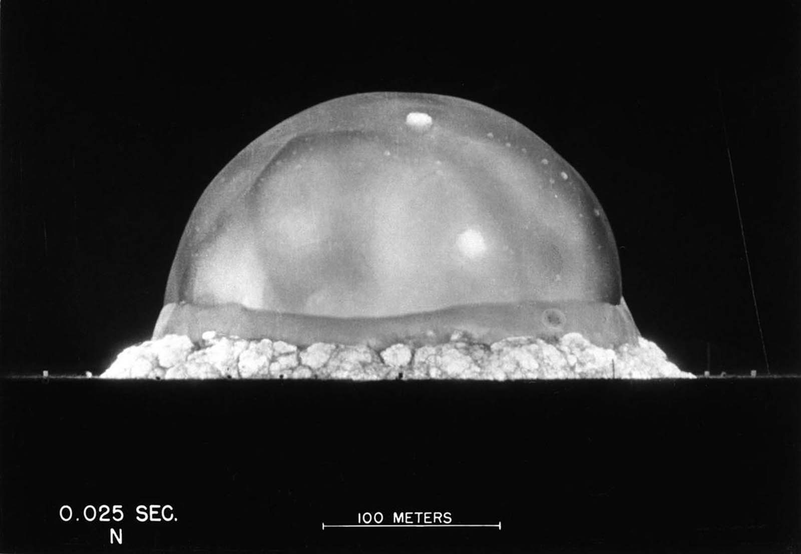 The expanding fireball and shockwave of the Trinity test explosion, seen .025 seconds after detonation in the New Mexico desert on July 16, 1945.