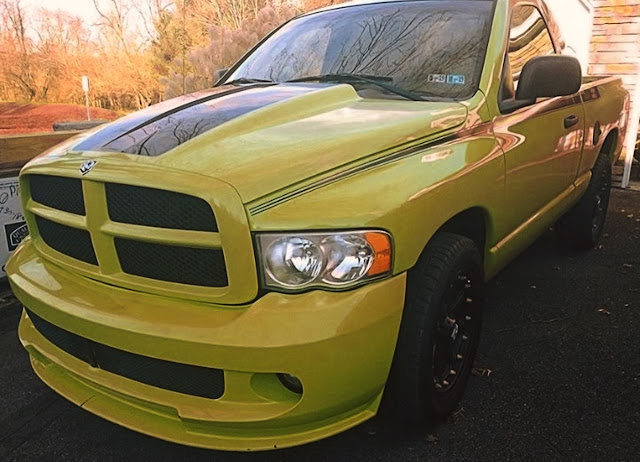 nice-yellow-ram-truck-with-black-stripes-decal-on-hood