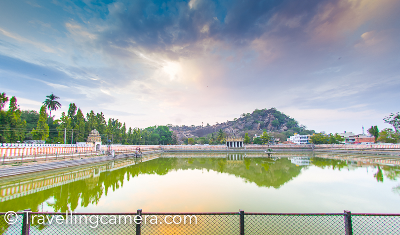 After coming down, he had coconut water and then boarded the coach for coming back to the Golden Chariot. The water pond you see in above photograph is called white pond and the same was visible from main temple on hill top. You would have noticed this pond in most of the photographs taken from main Jain of Shravanbelagola. 