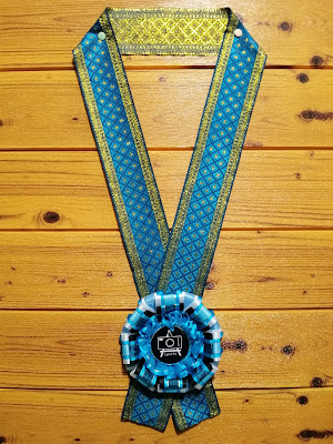Blue rosette lei for guest of honor This blue/black rosette leis was commissioned to be given to guest of honors and guest speakers of a Philippine-based event.