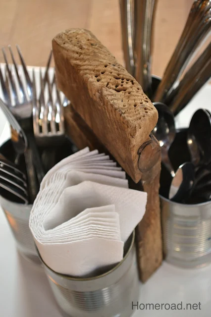 can organizer filled with napkins and silverware