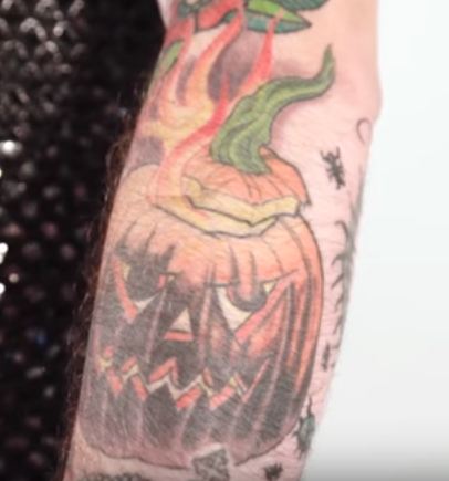 Pumpkin tattoo on hand