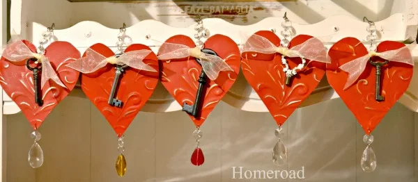 row of red heart ornaments with keys