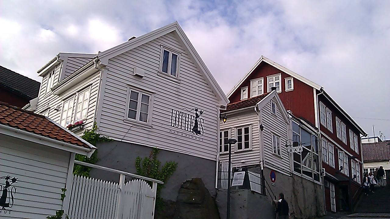 Note the similarities in the clapboard-style architecture in 'The Vincarage' image and this photo of the Lothes Mat & Vinhus in Haugesund, Norway. Photo: EuroTravelogue™. Unauthorized use is prohibited.
