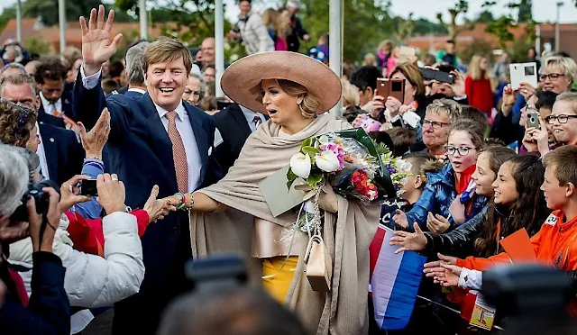 King Willem-Alexander and Queen Maxima visit during an region visit Zeeuws Vlaanderen