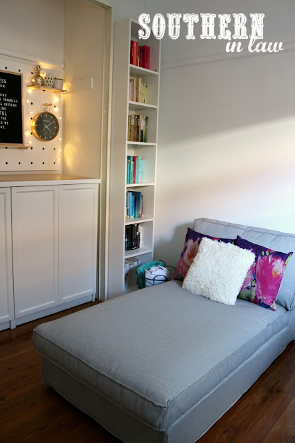 Spare Bedroom to Home Office Makeover on a Budget - Unique Home Office Ideas and How To's - IKEA Kivik Chaise Lounge with Color Coded Bookshelves