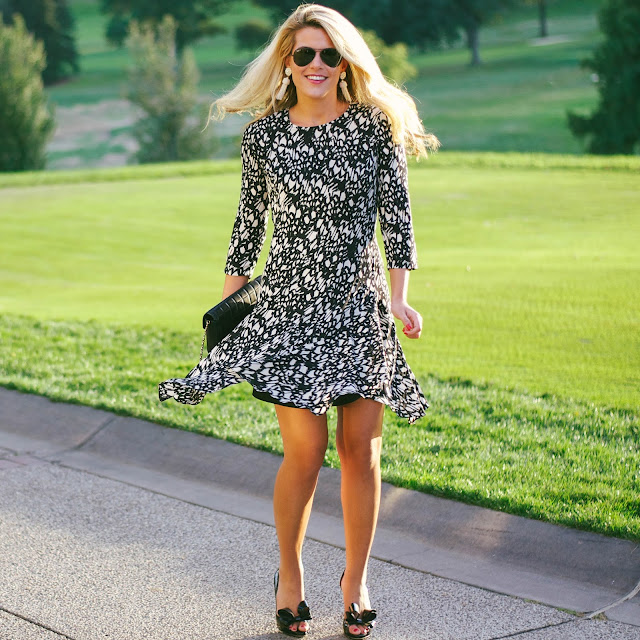 donna morgan print a line dress with valentino couture bow heels and chanel bag and lisi lerch tassel earrings