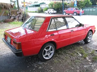 Buying a car in the Philippines. Red 1986 Mitsubishi Lancer in Philippines