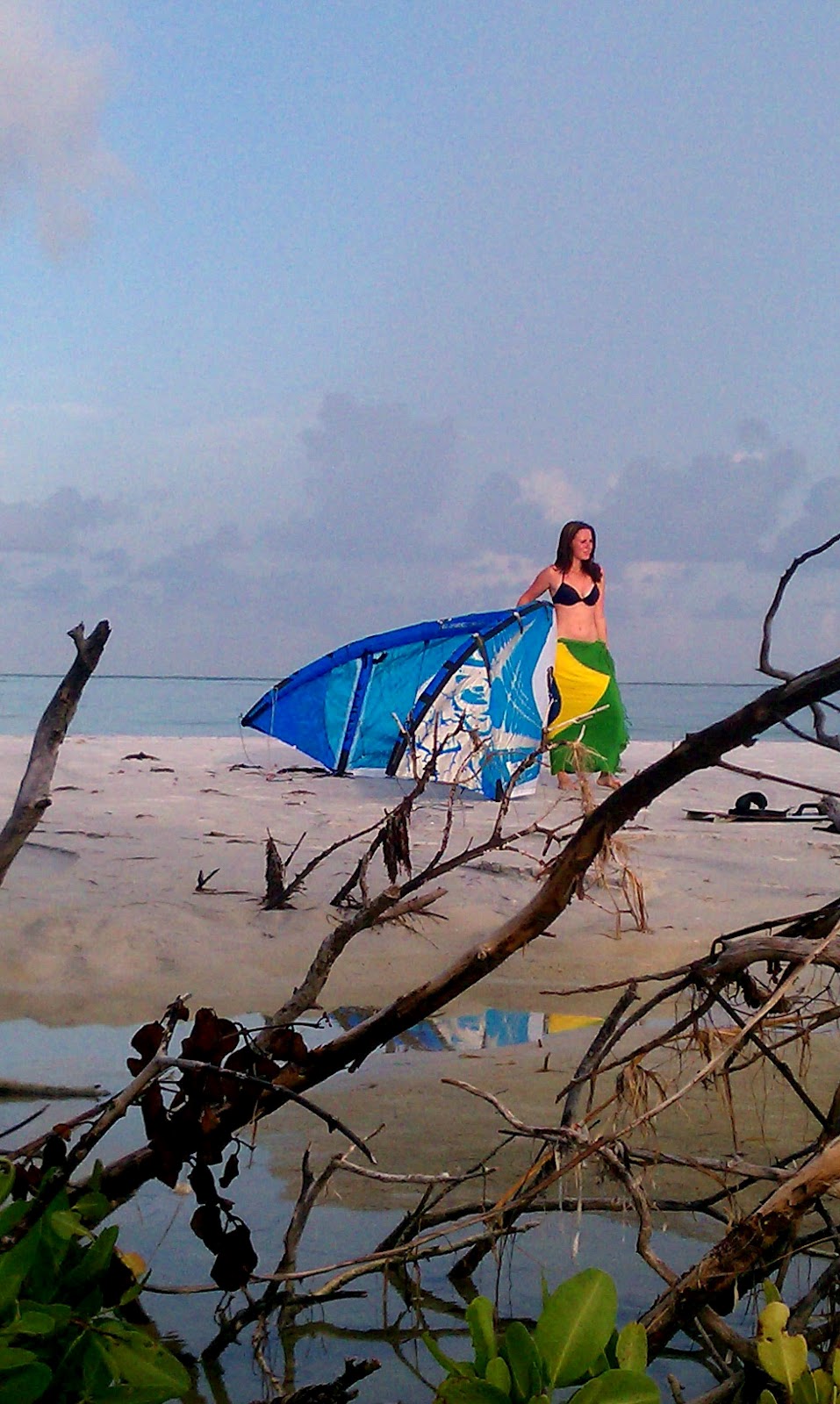 Kiss The Sky Kiteboarding Kiteboard girl Barbara setting up for a