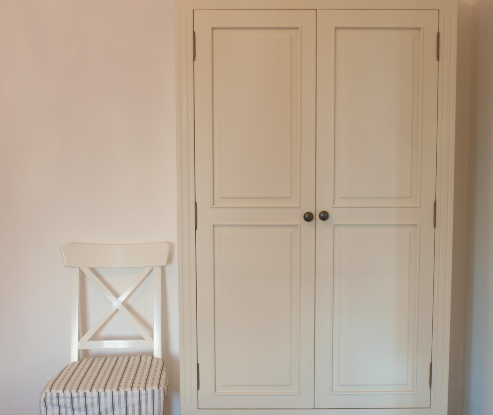 Swedish style white armoire in #Parisapartment - Hello Lovely Studio