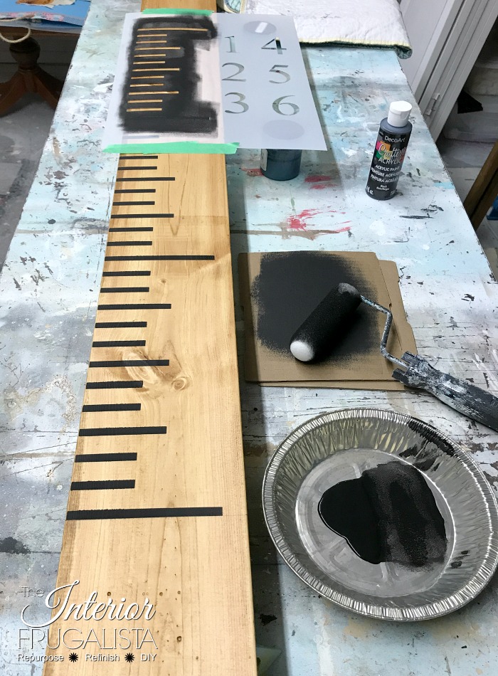 How to stencil a yardstick growth chart with black acrylic craft paint.