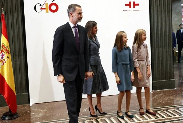 Queen Letizia wore Felipe Varela suit and Magrit Pumps, carried Hugo Boss Fanila clutch bag, Leonor and Sophia Carolina herrera dress