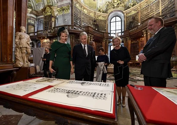 Queen Mathilde, Alexander Van der Bellen of Austria and his wife Doris Schmidauer. Mathilde wore Natan dress