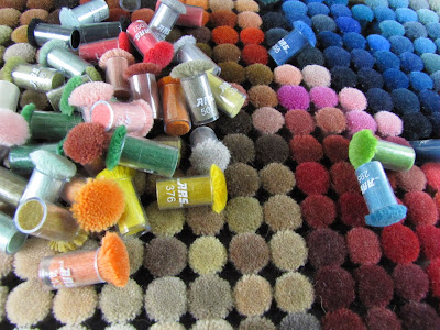 Wool pom poms for Judit Gueth custom rugs Judit Gueth custom rugs