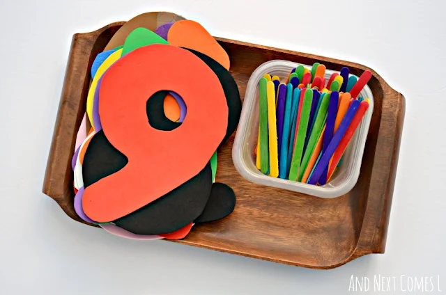 Tally mark math tray with foam numbers and colored craft sticks
