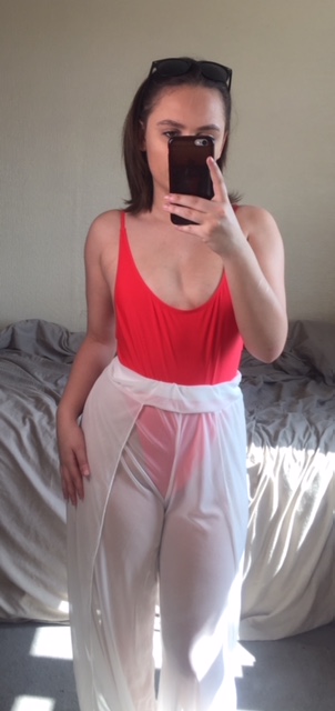 Red swimsuit with white trousers
