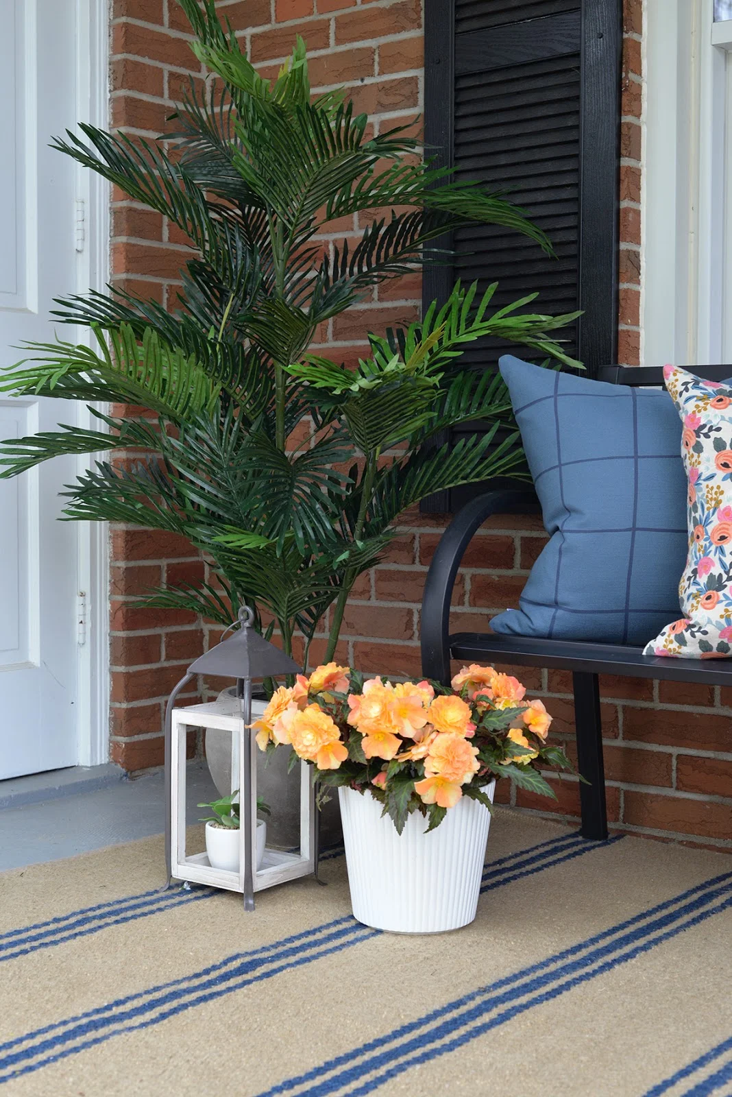 front porch decorated with artificial outdoor plants