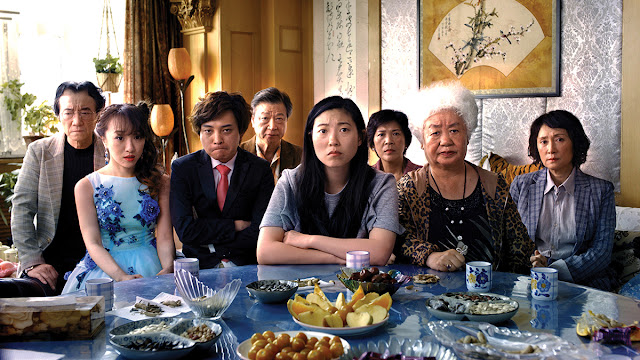awkwafina and a family look sad