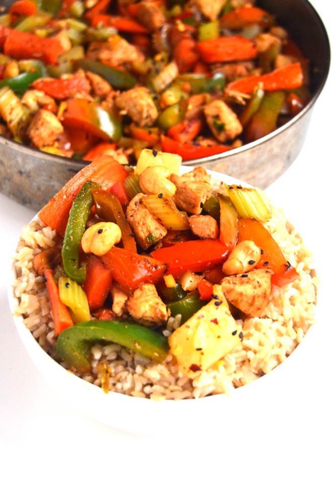 15 Minute Cashew Chicken is ready so easy to make and is the perfect lighter stir-fry with chicken, cashews, peppers, carrots, pineapple, celery and a delicious homemade sauce! www.nutritionistreviews.com
