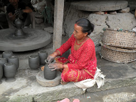 Nepali woman working with pottery