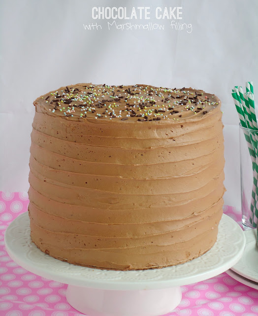 Six-Layer Chocolate Cake with Toasted Marshmallow Filling and Malted Chocolate Frosting Toasted marshmallow filled chocolate layer cake has six layers of heavenly, decadent, moist chocolate cake! Filled with a toasted marshmallow buttercream frosting and topped with malted chocolate frosting, this is an extraordinary cake for special occasions.