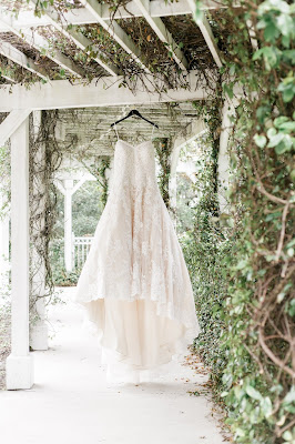lace wedding dress hanging