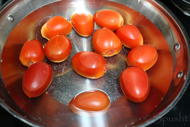 cook (blanch) tomatoes in boiling water