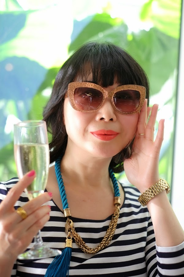 Vivienne trying the large golden Kate Spade sunglasses.