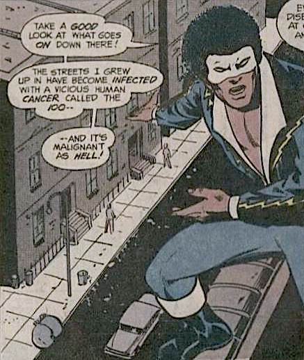 Black Lightning, in outfit that sports V-neck baring much of his chest, speaking to someone off-panel.