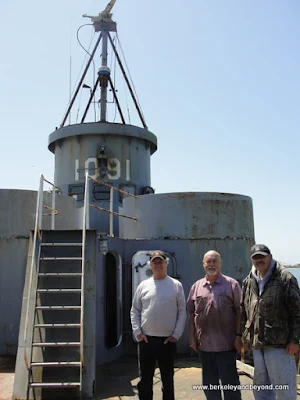 volunteers in front of gun tower on WWII Landing Craft at Humboldt Bay Naval Sea/Air Museum in Eureka, California