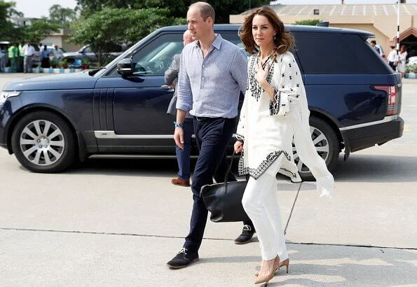 Kate Middleton wore a Kurta by Elan, one of Pakistan's leading design houses. Kate wore a crossover flat shoes by Russell and Bromley