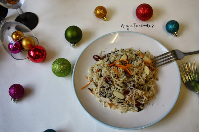 A plate of Boxing Day Jewelled Rice with spilled Christmas baubles from www.anyonita-nibbles.com