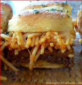 Spaghetti and Meatball Sliders, for an appetizer or a meal, these little hand held sandwiches have all the flavors of a spaghetti and meatball dinner | Recipe developed by www.BakingInATornado.com | #recipe #appetizer #sliders