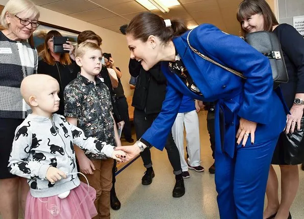 Crown Princess Victoria's Children and Youth Hospital. Erdem x H&M floral blouse Af Klingberg boots, Valentino shoulder bag