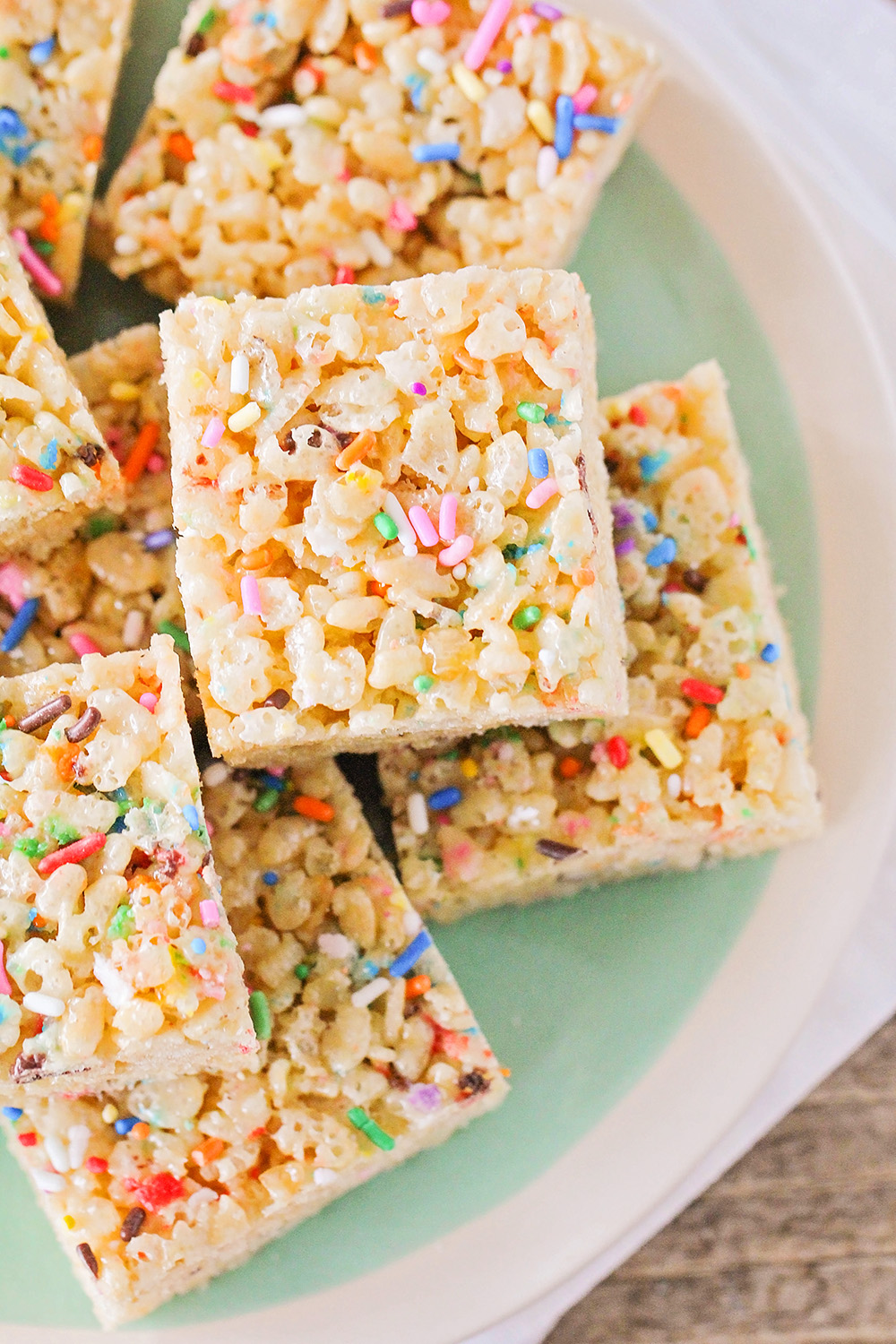 These cake batter rice krispy treats taste just like birthday cake and are loaded with colorful sprinkles. So easy to make and the kids will love them!