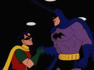 Batman dandole la mano a Robin