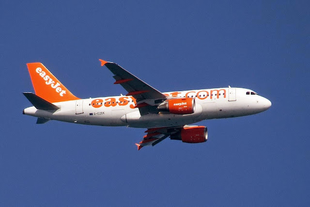 EasyJet Airbus A318-321 G-EZDK, over the port of Livorno