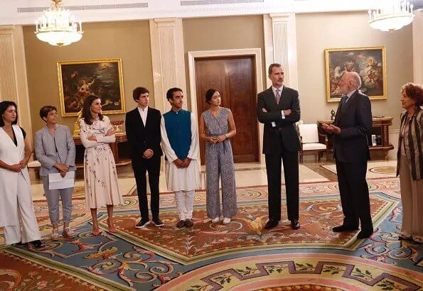 Queen Letizia wore Asos Design Tall midi dress with pretty floral and bird embroidery, and Magrit pink pumps and Magrit pink bag