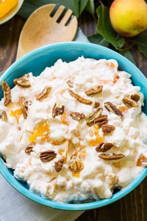 Millionaire Peach Salad (Peach Fluff) is one of those delicious Cool Whip concoctions that's really more like a dessert than a salad. It's full of peaches, marshmallows, and pecans and makes a great potluck recipe