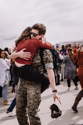Marine and Wife reuniting at their homecoming after a long deployment at Marine Core Air Station Miramar with VMFA 225 by Morning Owl Fine Art photography San Diego.