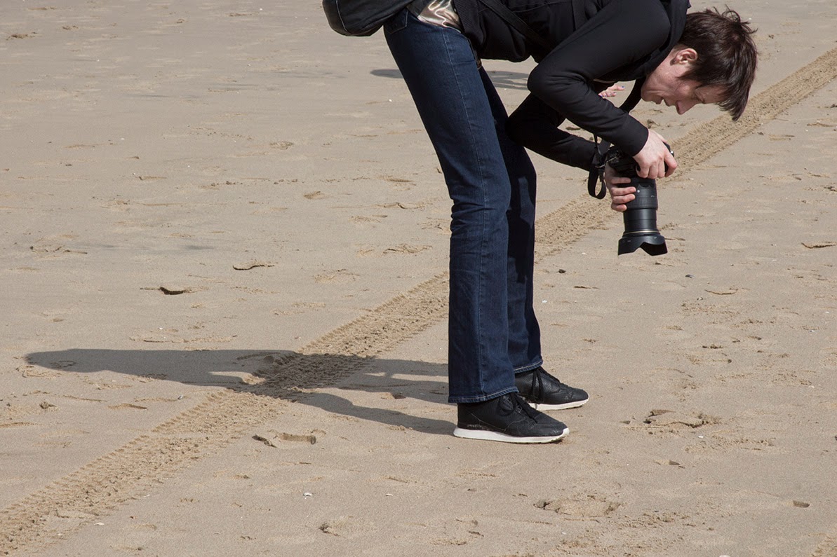 participant taking picture of sand